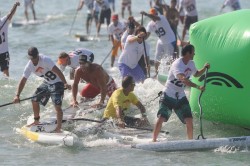 Chuck Patterson spears Paul Jackson @ the 2010 Battle of the Paddle // pic © Dave Chun/Kialoa