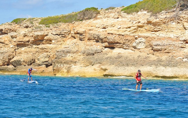 Connor Baxter and Travis Grant stand up paddling