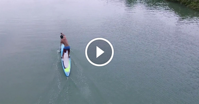 Travis Grant stand up paddling
